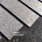 Texrure - decorative finishing of paving of a street fountain marble slabs of different levels of grinding covered with a thin layer of water.